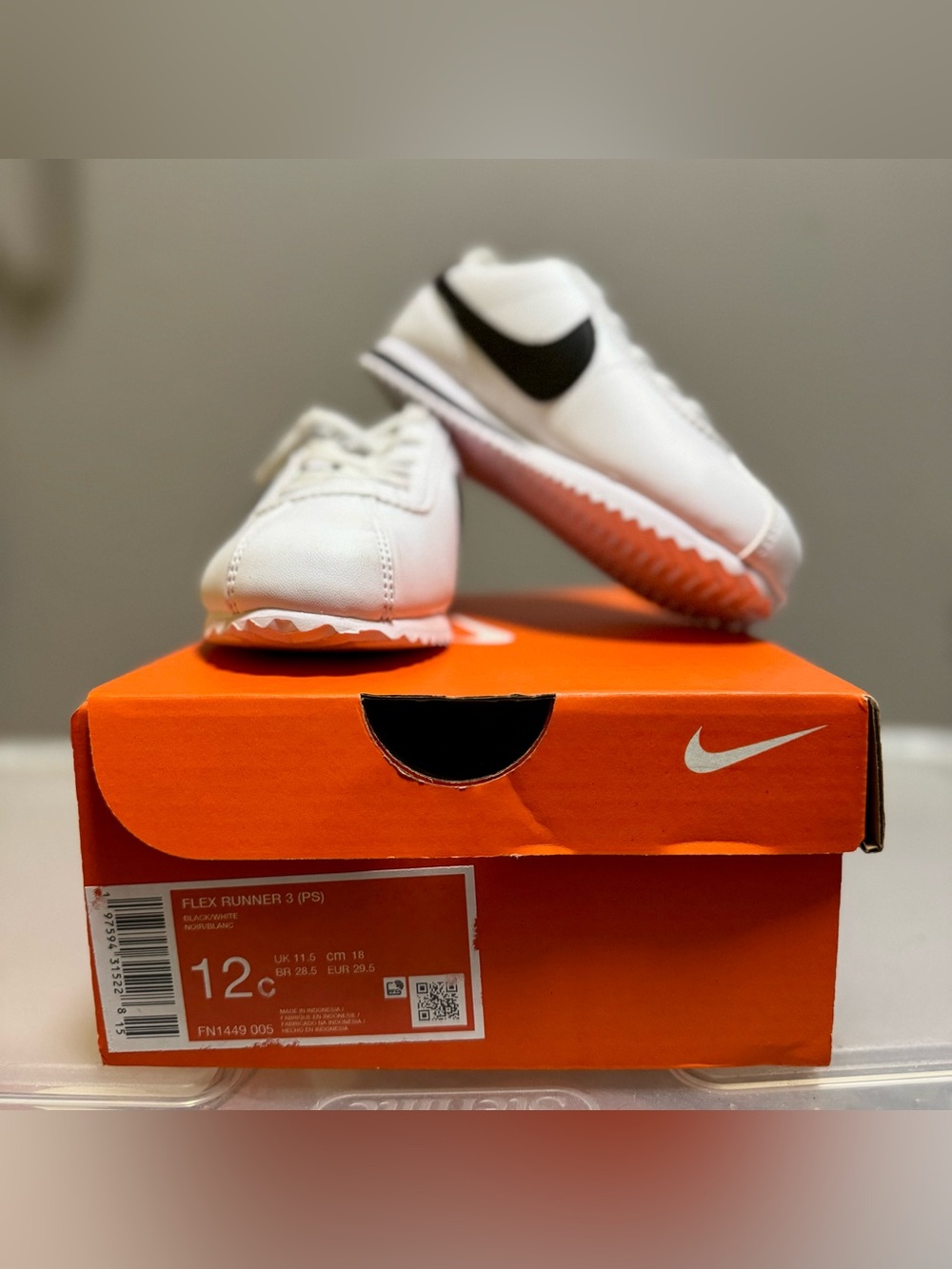 Nike Kids White Sneakers with Black Swoosh